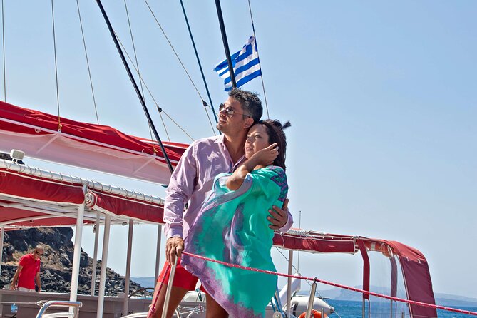 Santorini Cruise on Catamaran with BBQ & Open Bar - The Sail-By Moment Before the Next Beach