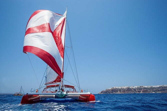 Santorini Cruise on Catamaran with BBQ & Open Bar - Stop 2: Red Beach for Photos, Swimming, and Snorkeling