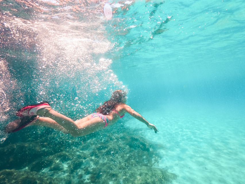 Santorini: Day Cruise with Meal & Open Bar - Red Beach: where you swim and also explore the seabed
