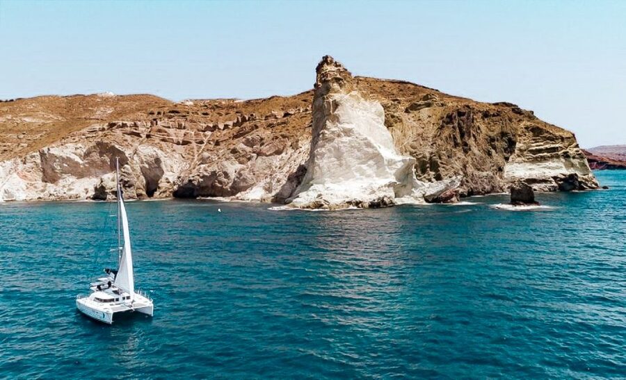 Santorini: Day Cruise with Meal & Open Bar - White Beach, Black Mountain, and the lighthouse: great for photos, not just passing by