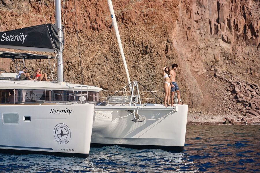 Santorini: Day Luxury Catamaran Cruise with Meal & Drinks - The Fira old harbor and Armeni Bay passing moments