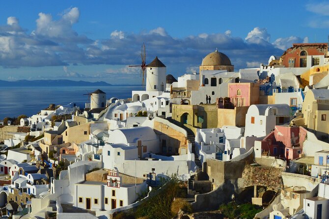Santorini Essentials Half Day Private Sightseeing Tour - Oia for one hour: cliffside views, shop lanes, and castle ruins