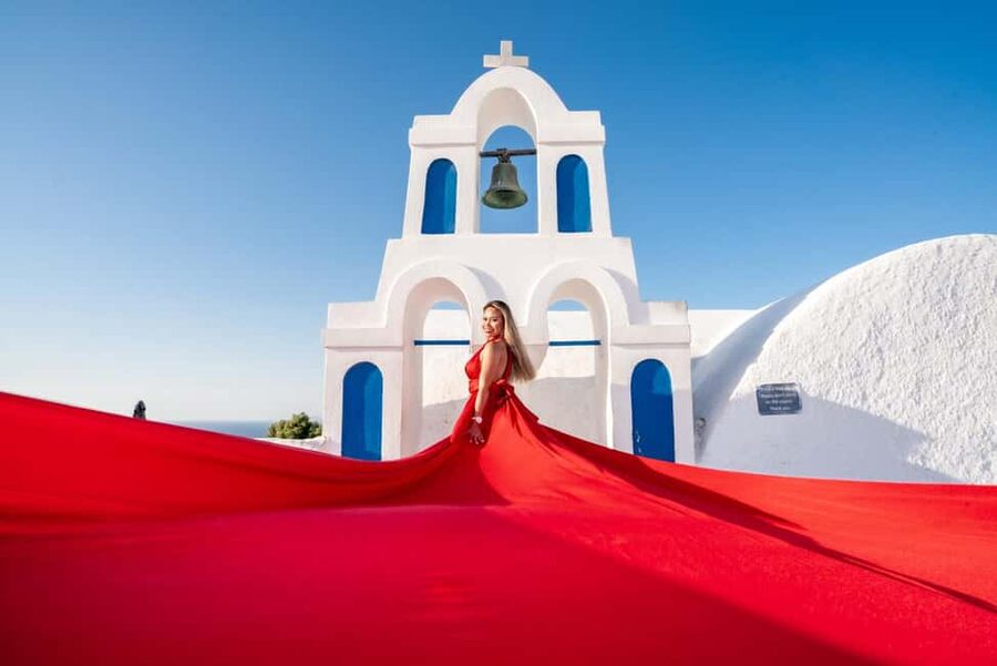 Santorini: Flying Dress Rental - Santorini backdrops: white walls, blue domes, and dress movement