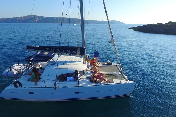 Santorini Full Day Catamaran Private Cruise incl. Meal, Drinks & Free Transport - Faros lighthouse: quick stop, big payoff for viewpoints