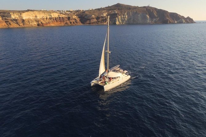 Santorini Full Day Catamaran Private Cruise incl. Meal, Drinks & Free Transport - Oia, Imerovigli, and Firostefani: the caldera villages stop feeling different from a bus ride