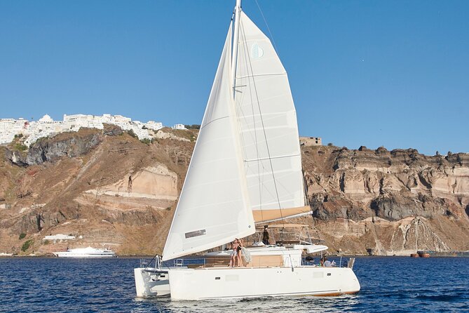 Santorini Gold Catamaran Cruise with BBQ, Drinks and Hotel Pickup - Mesa Pigadia Beach plus BBQ: the meal stop that makes the cruise feel complete