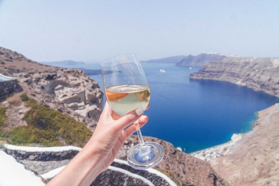Santorini: Guided Wine Tour with Pickup and Snacks - Venetsanos Winery: caldera views over Athinios port