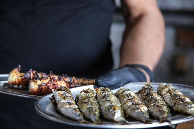 Santorini Highlights Small-Group Tour with Authentic Greek Lunch - Perivolos black beach lunch and your swim break