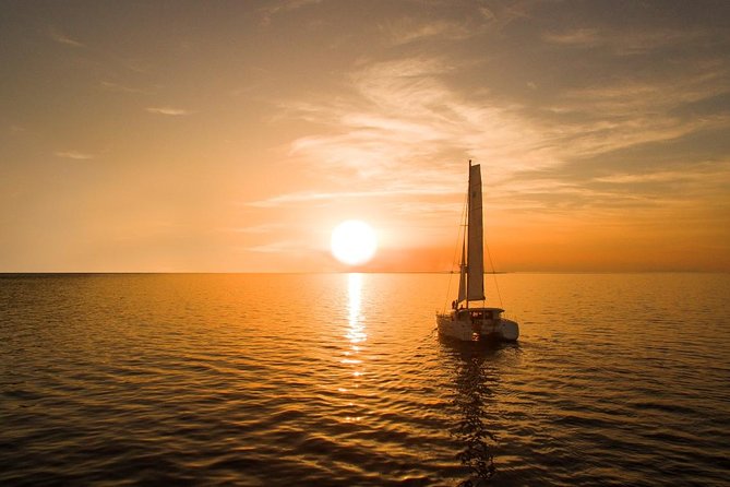 Santorini Luxury Catamaran Sunset Cruise with BBQ, Drink and Transfer - Hot springs swim: what warm water near the volcano really feels like