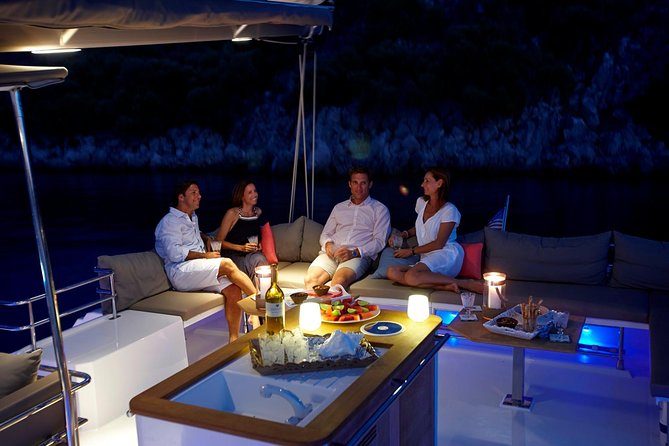 Santorini Luxury Catamaran Sunset Cruise with BBQ, Drink and Transfer - Red Beach snorkeling stop: fast water time, strong photo payoff