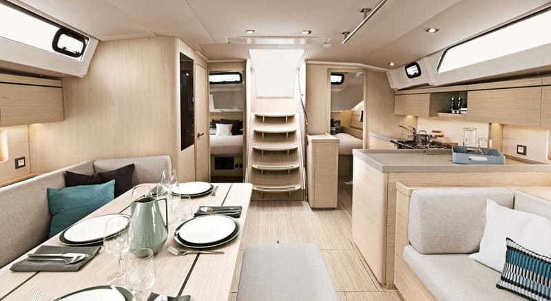 Santorini: Luxury Private Sailing Cruise Experience - Anchored Views at Sea Level: Red Beach, White Beach, and the Black Mountain Coves