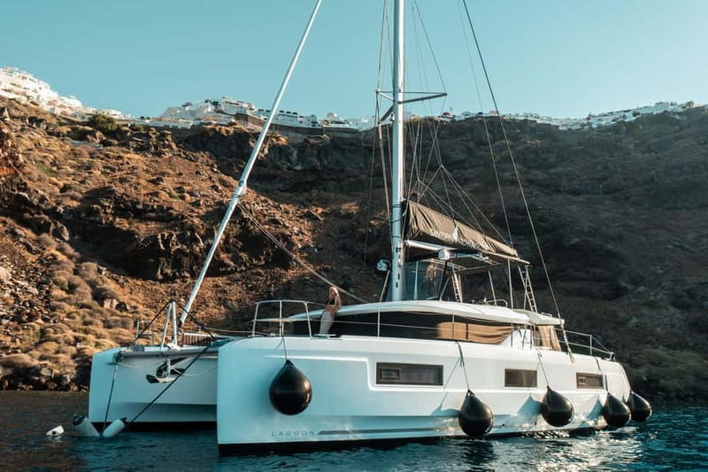Santorini: Majestic Catamaran Cruise with Meal and Drinks - Day cruise vs sunset cruise, and what changes in your experience