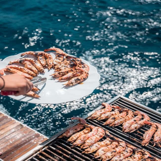 Santorini: Majestic Catamaran Cruise with Meal and Drinks - Volcano energy and hot springs: the stop you remember longer