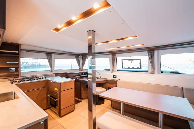 Santorini: Majestic Catamaran Cruise with Meal and Drinks - The caldera sights between swims, including the lighthouse and landmarks