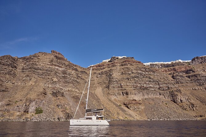 Santorini Oia: Caldera Luxury Day Cruise with BBQ & Drinks - Thirassia Island stop: calm water, easy snorkel, and a different feel than Oia