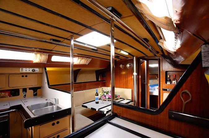 Santorini Oia: Private Sailing Yacht Cruise with Meal and Drinks - The crew experience: attentive service without drama