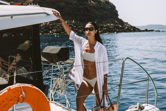 Santorini Oia: Private Sunset Catamaran Cruise with BBQ & Drinks - Stop 1: Thirassia Island swim time in calm turquoise water