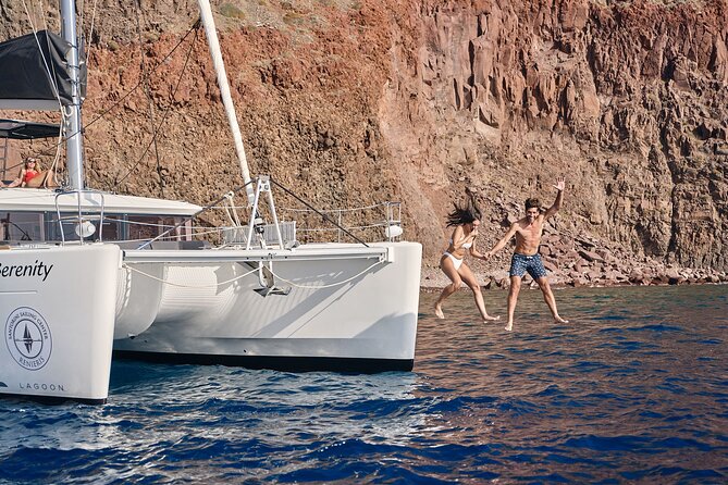 Santorini Oia: Private Sunset Catamaran Cruise with BBQ & Drinks - Stop 3: Nea Kameni, lava rocks and the salt-float effect