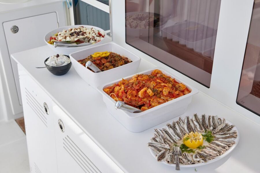 Santorini: Platinum Catamaran Cruise w/ BBQ Meal & Open Bar - The Platinum catamaran feel: 18 guests, real comfort, and a fun crew rhythm