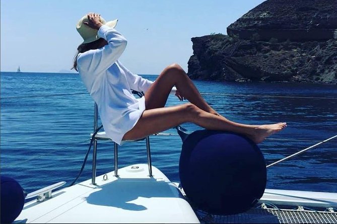 Santorini Platinum Catamaran Cruise with Meal, BBQ and Open Bar - Volcano hot springs: caves, volcanic beaches, and the real payoff