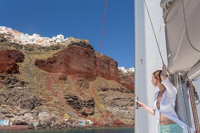 Santorini Private Catamaran Cruise with BBQ, Open Bar & Transfers - Indian Rocks and the caldera from sea level