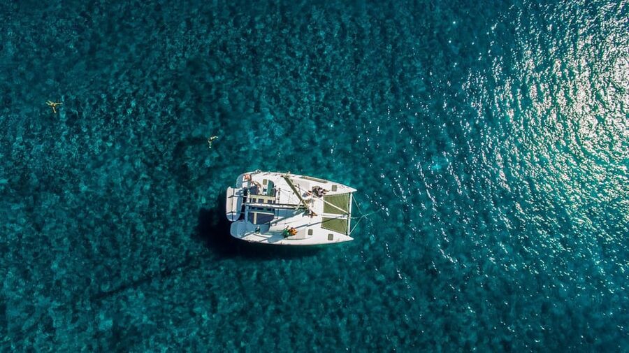 Santorini: Private Catamaran Cruise with Food & Drinks - Private Catamaran Time on the Santorini Caldera