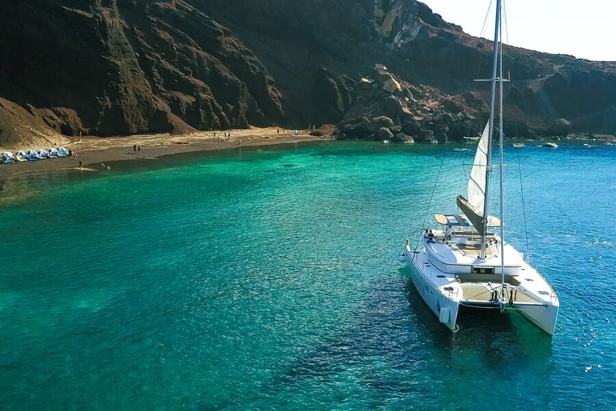 Santorini: Private Catamaran Tour with BBQ Meal and Drinks - What the crew and guides do with a private boat
