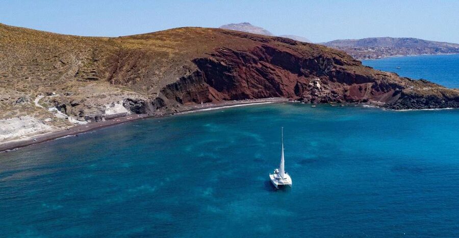 Santorini: Private Day Cruise with a BBQ meal and Open Bar - Red, White, Black Beaches, Plus a Lighthouse Stop You Will Remember