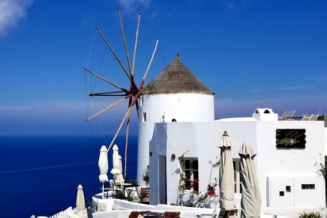 Santorini Private Driver: Explore Santorini - Port & Hotel Pickup - Fira’s Three Bells and the Classic Blue-Dome Photo Moment