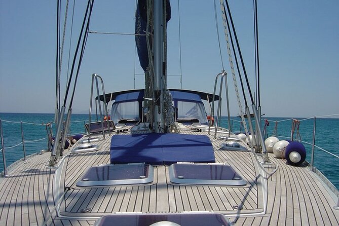 Santorini: Private Sailing Yacht Cruise with Meal and Drinks - Red Beach and the unreal Red-to-White coast you see from onboard