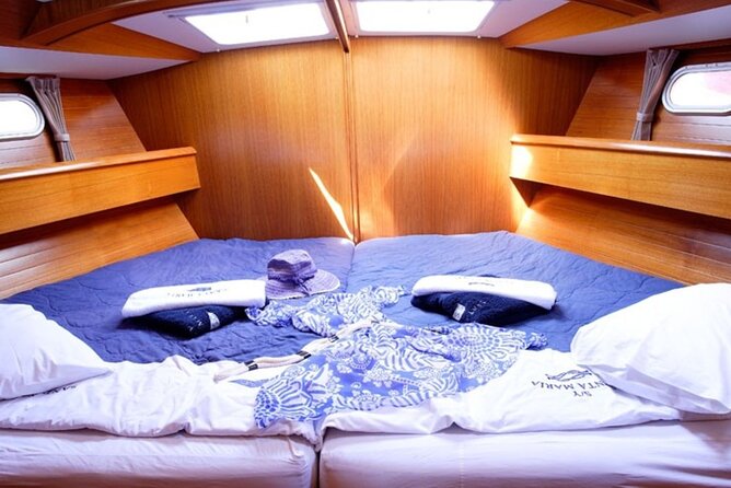 Santorini: Private Sailing Yacht Cruise with Meal and Drinks - Nea Kameni Island: the longer stop where dinner and snorkeling meet