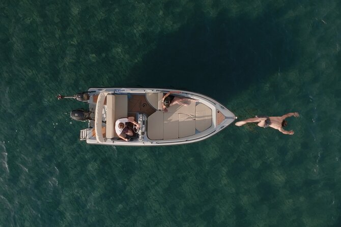 Santorini Rent a Boat - License free private cruise - The comfort kit that makes swimming stops actually enjoyable