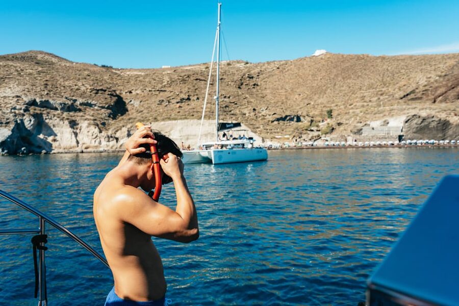 Santorini: Sailing Catamaran Cruise with BBQ and Drinks - Mesa Pigadia: Black Rock Caves, Swimming, and BBQ Lunch