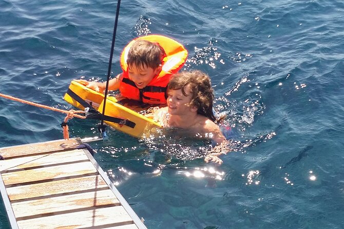 Santorini Semi-private Morning or Sunset Volcano Sailing Tour - The morning route along volcanic beaches and cliff coastlines