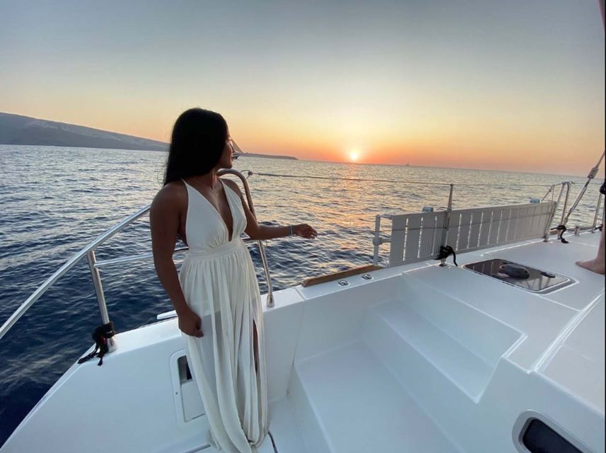 Santorini: Sunset Cruise with Greek Dinner and Transfer - Hotel transfers and a modern catamaran setup