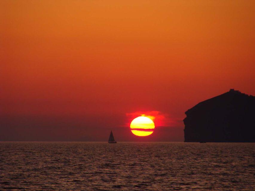 Santorini: Sunset Cruise with Greek Dinner and Transfer - Group size, crew energy, and what this feels like in real life