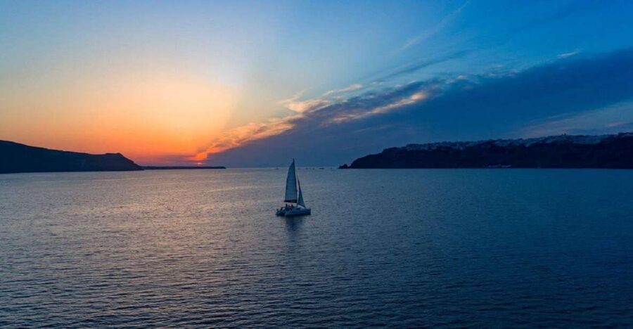 Santorini: Sunset Cruise with Swim Stops, Dinner, and Drinks - The Volcanic Coastline Tour: Red, White, and Black Beaches From the Water