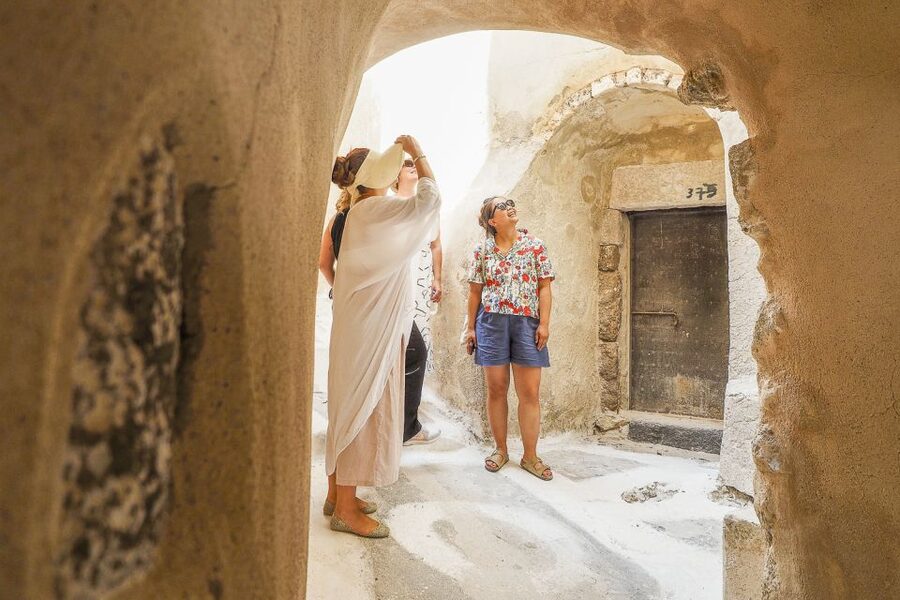 Santorini: Top Sights Day Trip, Wine Tasting, & Oia Sunset - Emporio and the Venetian fortress: a maze of doorways and arches