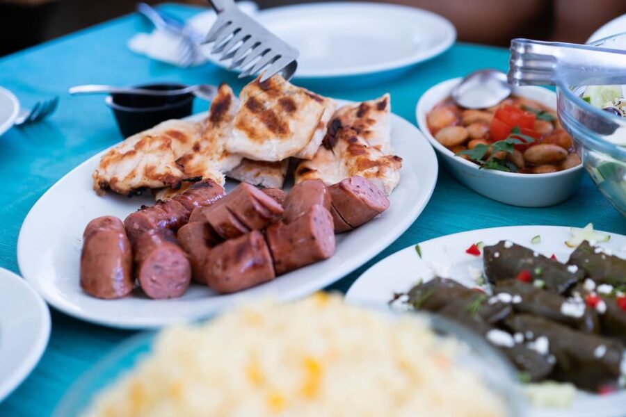 Santorini: Traditional Wooden Boat Tour with Meal and Wine - Black Mountain and the Snorkeling Moment You Came For