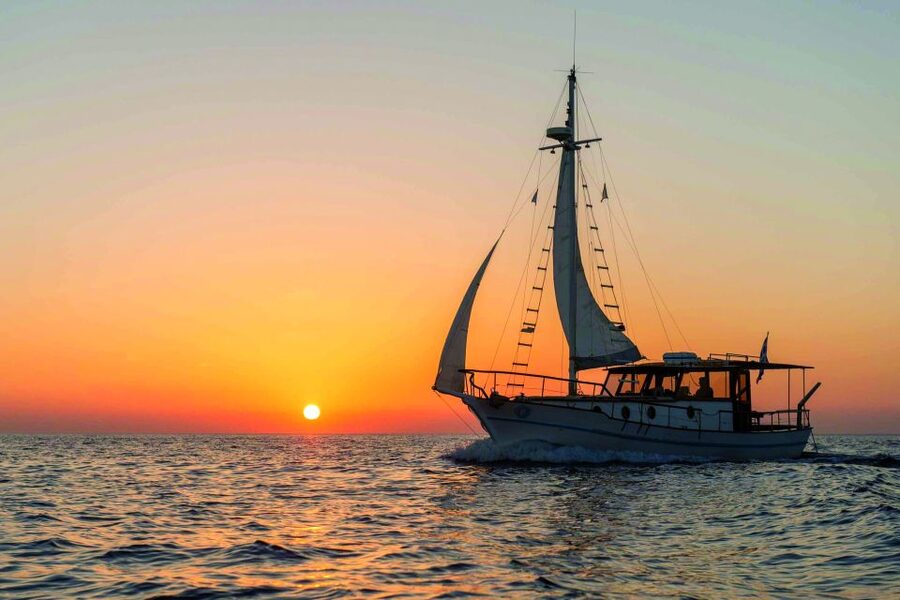 Santorini: Traditional Wooden Boat Tour with Meal and Wine - Thirassia Island: Fishermen’s Shores and Another Snorkeling Break