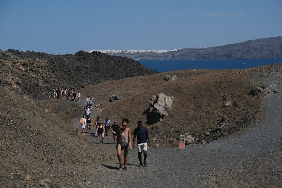 Santorini: Volcano and Hot Springs Sunset Dinner Cruise - Nea Kameni volcano hike: steep terrain, good views, smart pacing