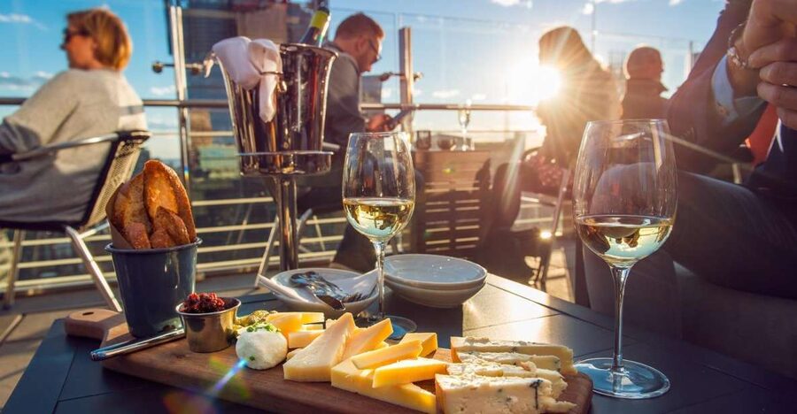 Santorini: Volcano and Hot Springs Sunset Dinner Cruise - Hotel pickup to Athinios Port, what your 8 hours really feel like