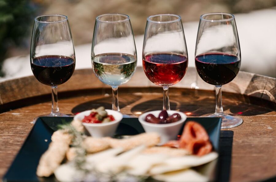 Santorini: Wine Tasting Tour to 3 Wineries with Transfer - Guides, Humor, and How Names Come Up for a Reason
