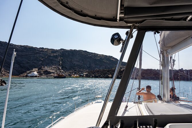 Semi Private Santorini Catamaran Tour - White Beach stop: color, rock shapes, and quick water time