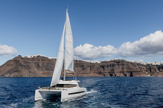 Shared Catamaran Half Day Cruise in Santorini - Akrotiri Lighthouse: an old landmark from the far southwestern tip