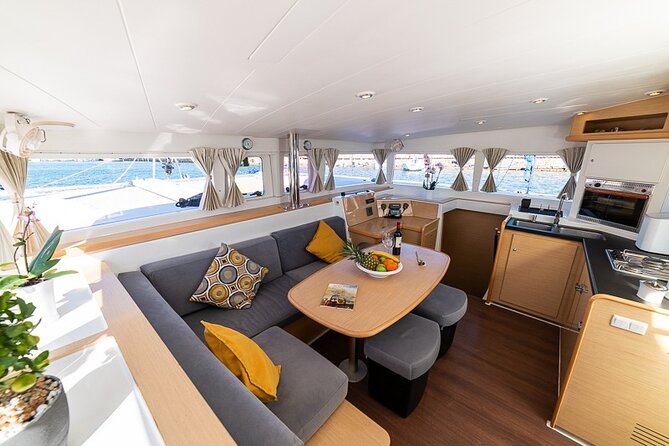 Small Group Santorini Catamaran Cruise with BBQ - Getting to the boat: Fira hotel pickup and cruise-ship meeting spot
