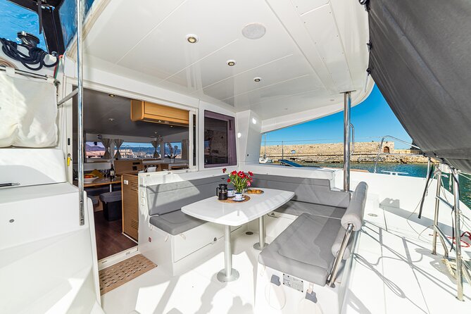 Small Group Santorini Catamaran Cruise with BBQ - Santorini Volcano and Nea Kameni hot springs: what to expect