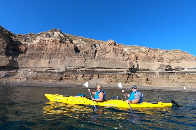 Small-Group Santorini Sea Caves Kayak Trip with Snorkeling & Picnic - Sea caves and the blue-light moment you will want photos for
