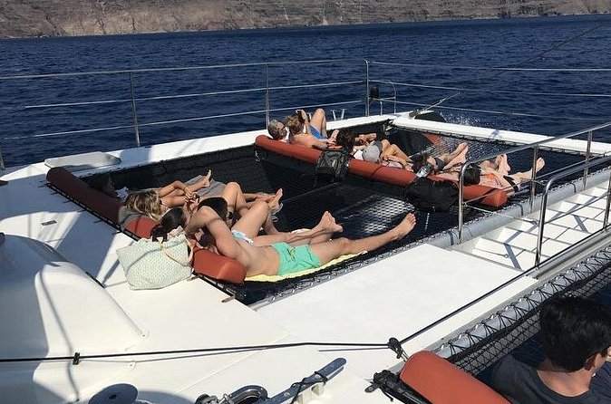 Sunset Catamaran Cruise Tahiti - White Beach and Photos Under Oia’s Shadow